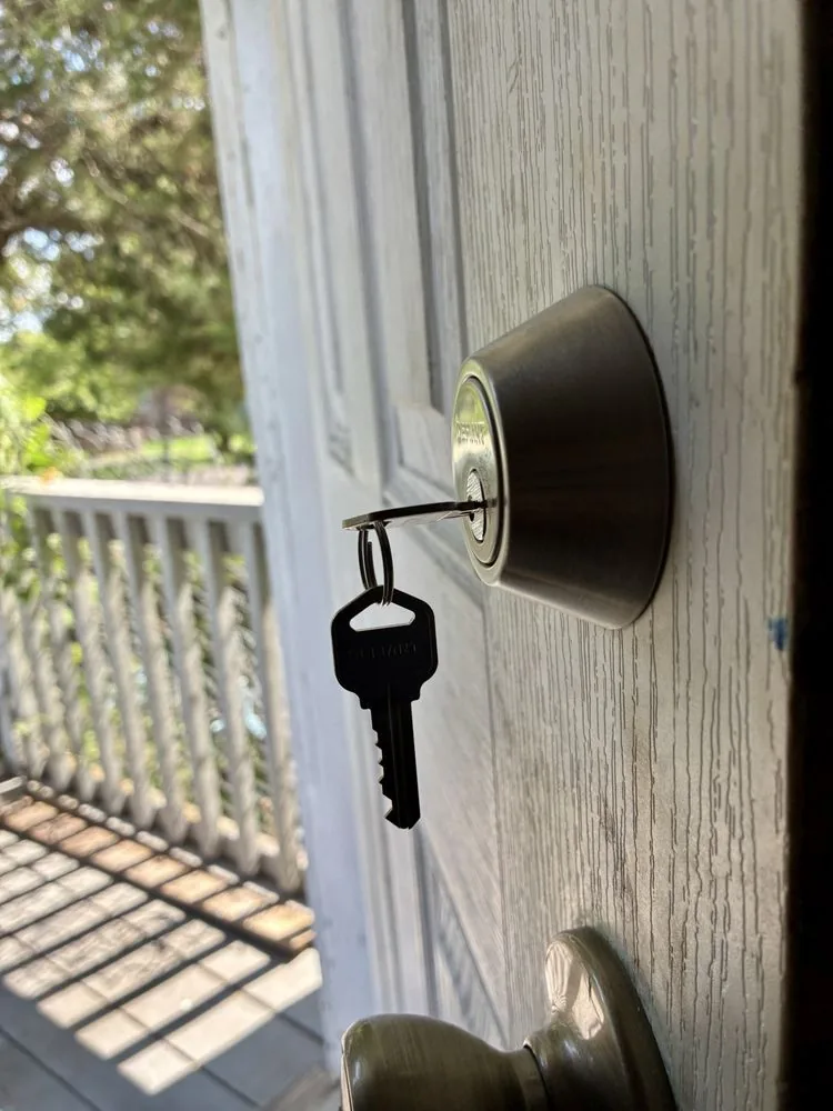 House key inserted into a residential door deadbolt